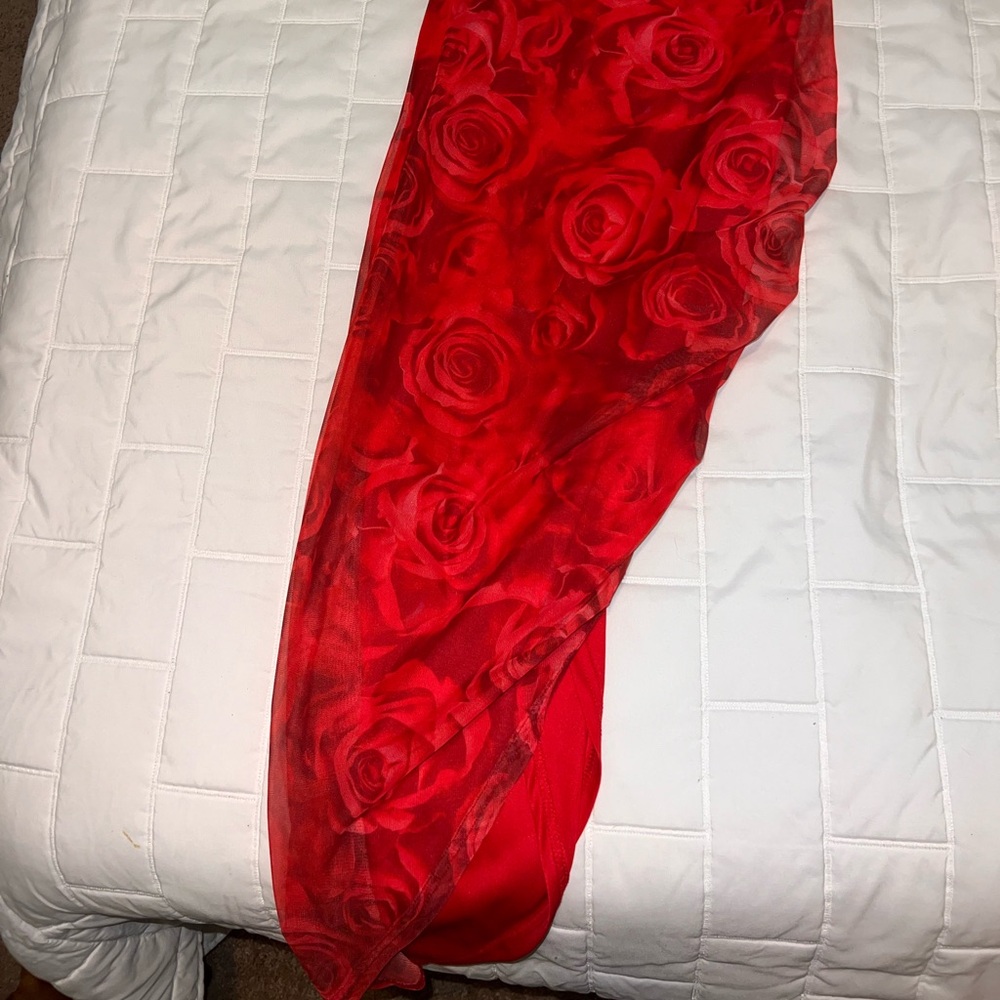 Beautiful new red long dress with roses and a split on one side .